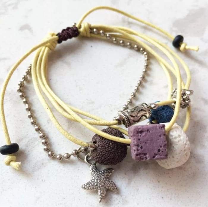 Yellow Lava Stone Essential Oil Bracelet with natural lava charms, perfect for aromatherapy.