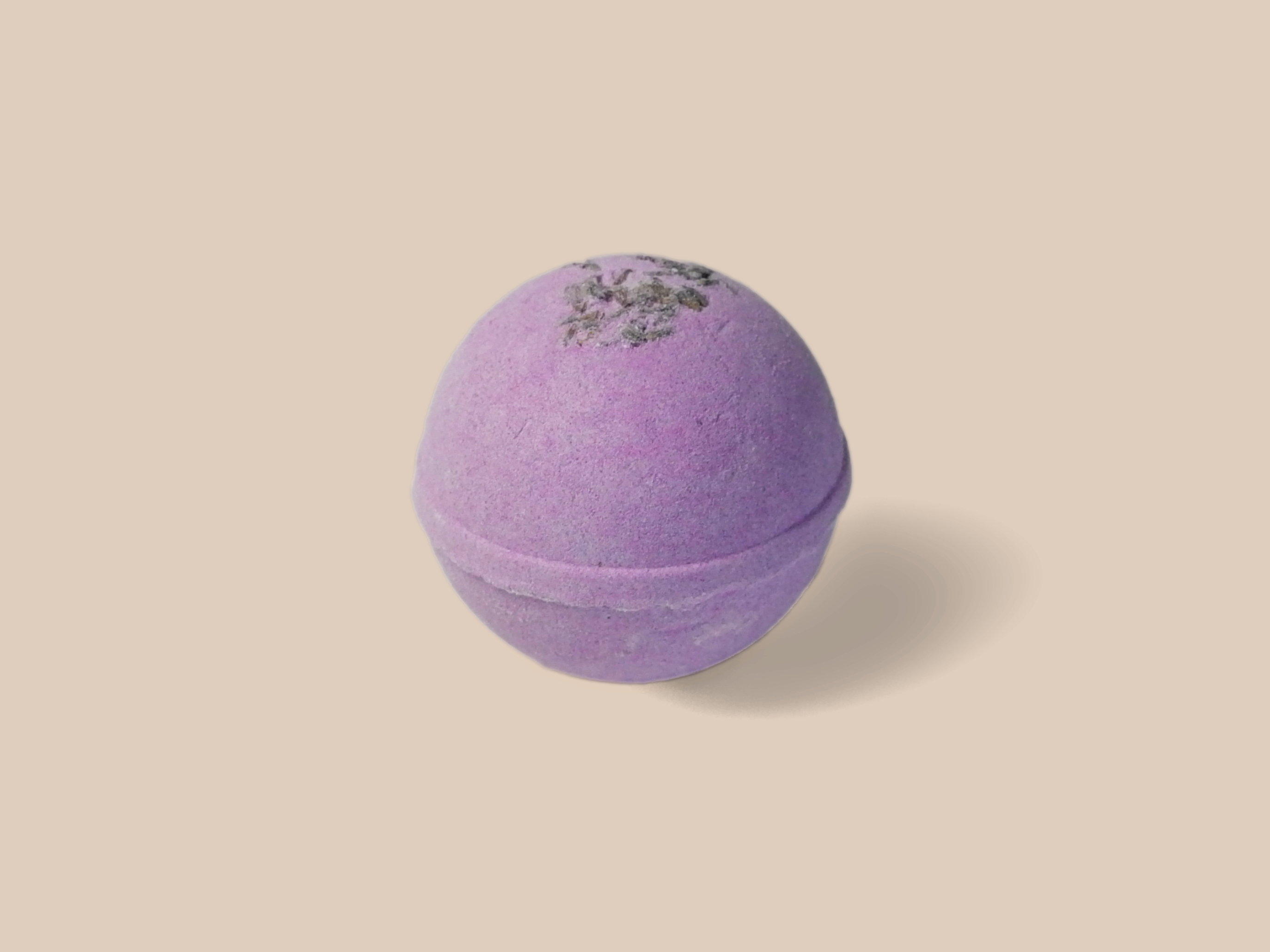 Lavender Bergamot Bath Bomb with flower petals, showcasing its vibrant color and organic ingredients.