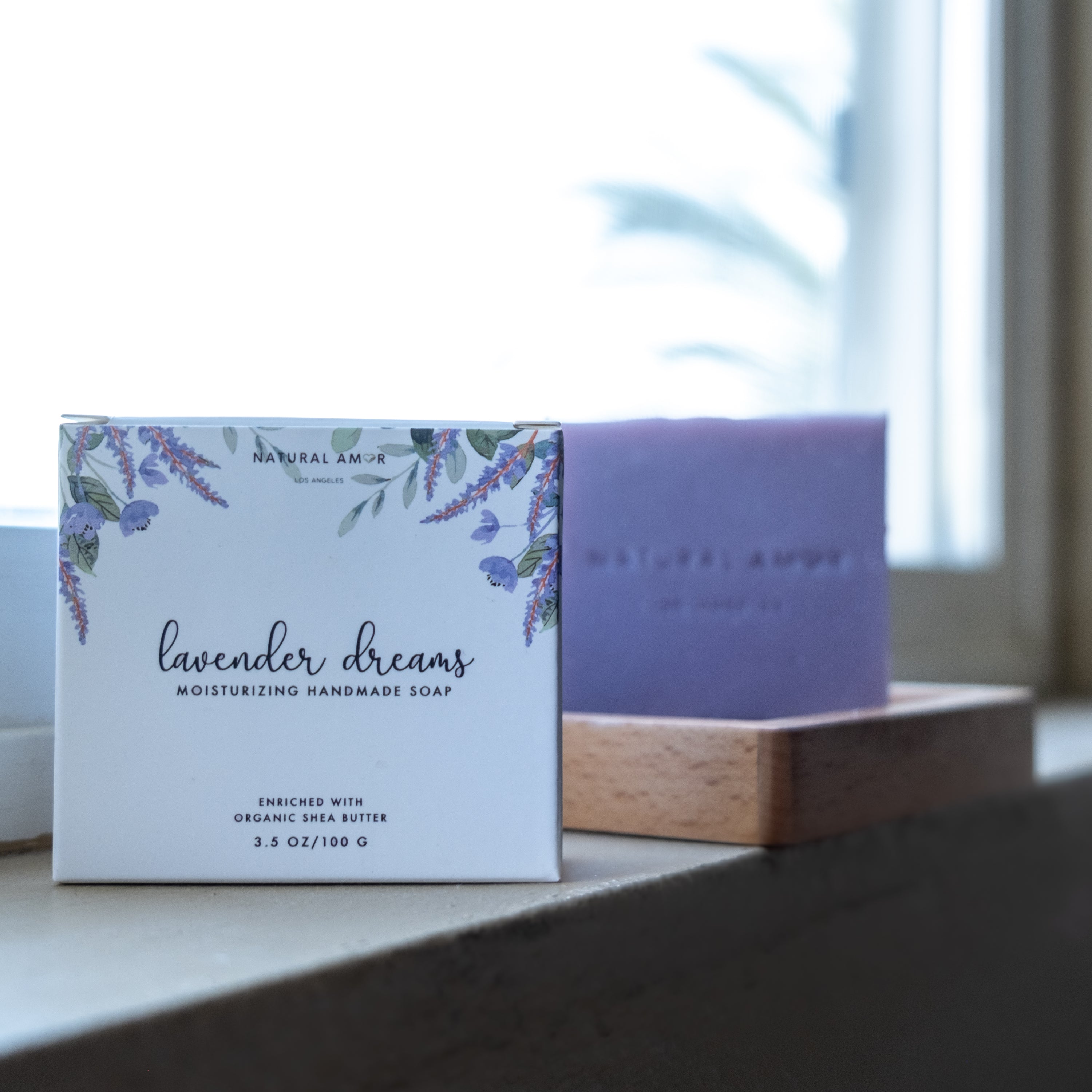 Lavender Dreams Soap Bar in a beautiful paper box, showcasing its natural ingredients and calming lavender scent.