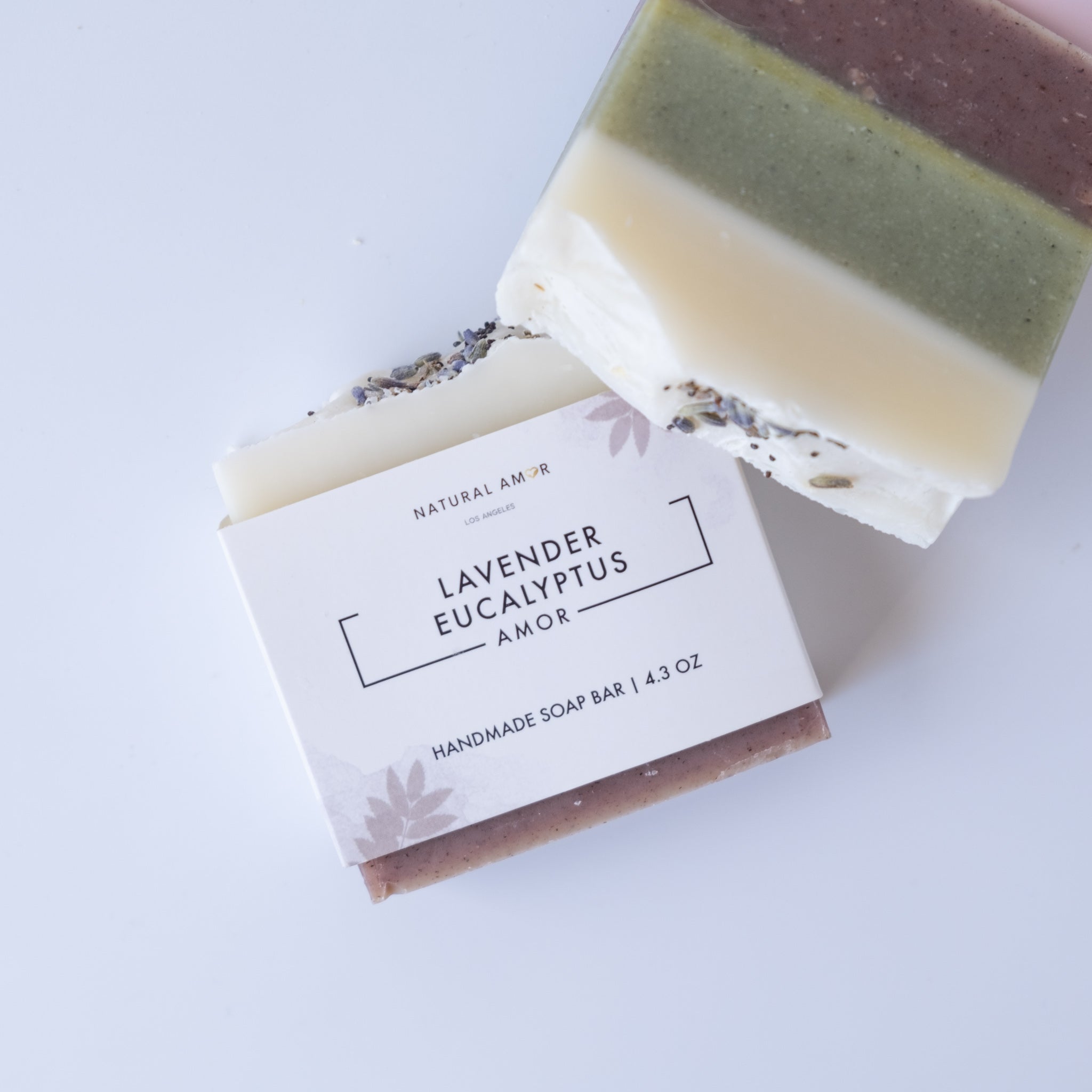 Lavender Eucalyptus Soap Bar with three colorful layers, showcasing natural ingredients and a calming lavender scent.