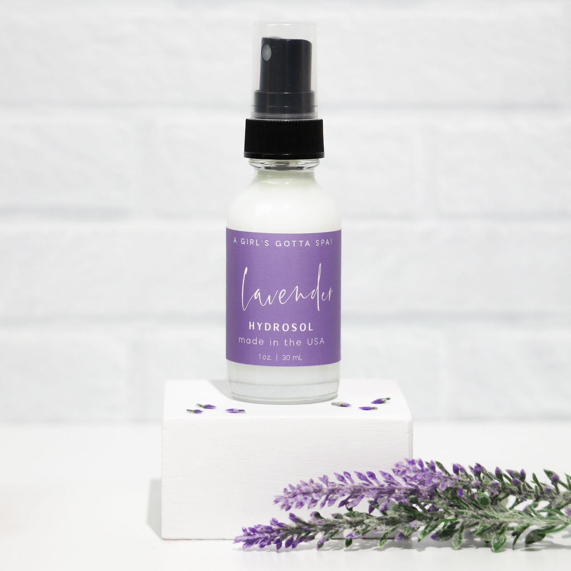 A bottle of Lavender Hydrosol Aromatherapy Pillow Spray with a calming lavender background, showcasing its natural ingredients.