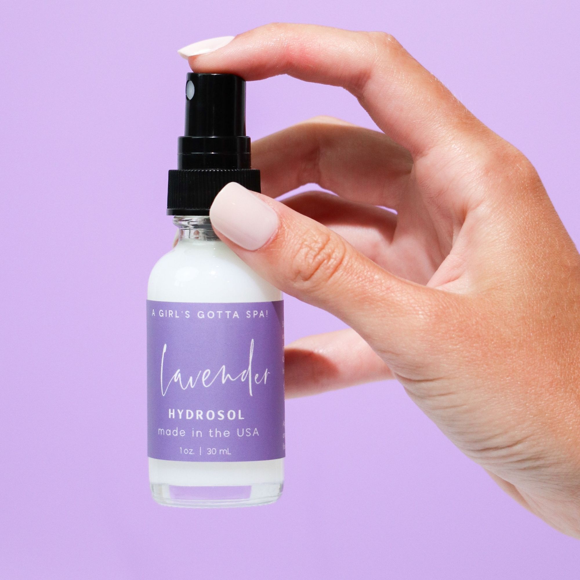 A bottle of Lavender Hydrosol Aromatherapy Pillow Spray with a calming lavender background, showcasing its natural ingredients.