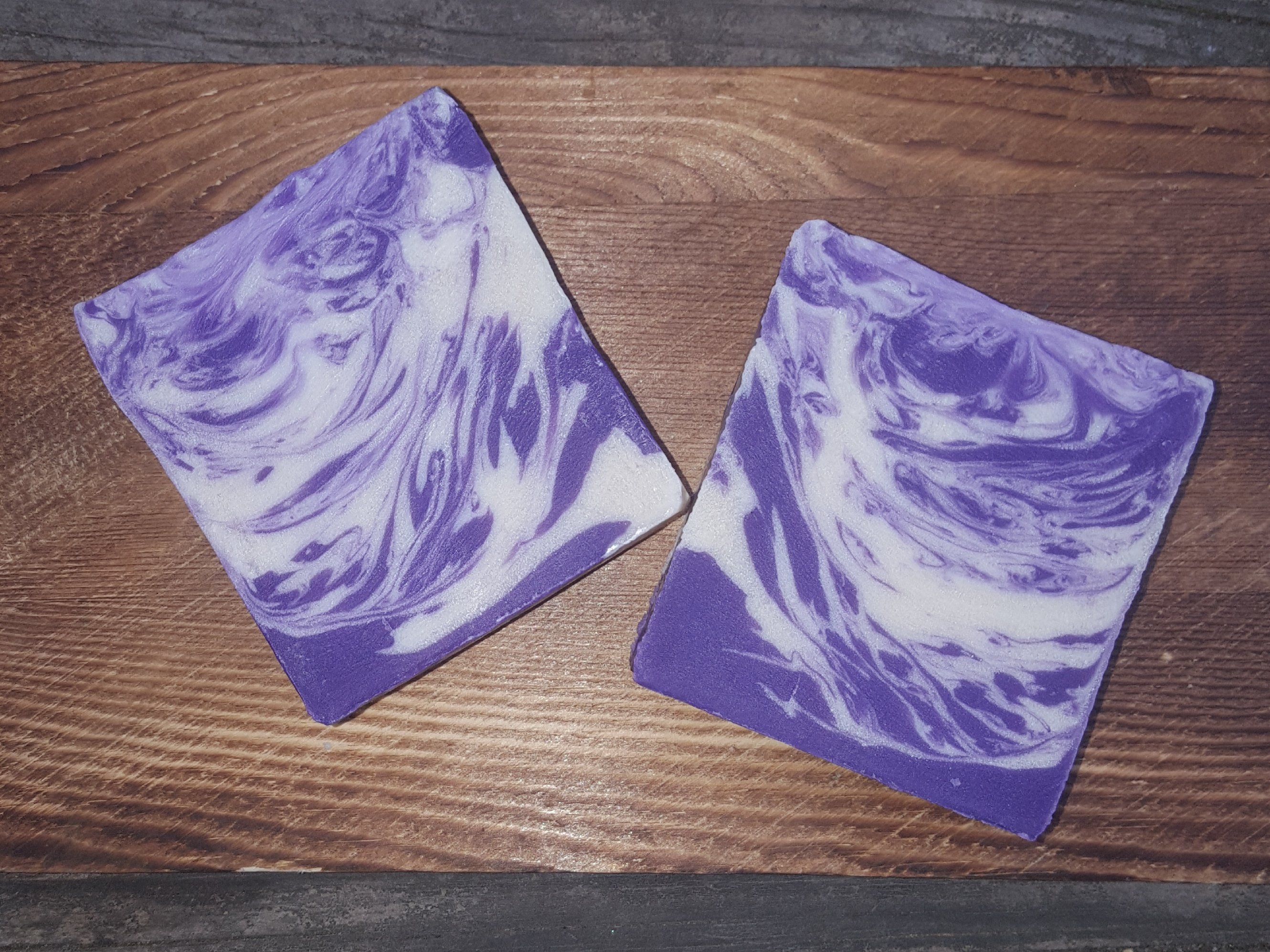 Artisan Lavender Soap bar with a rich purple hue, showcasing its natural ingredients and handmade quality.