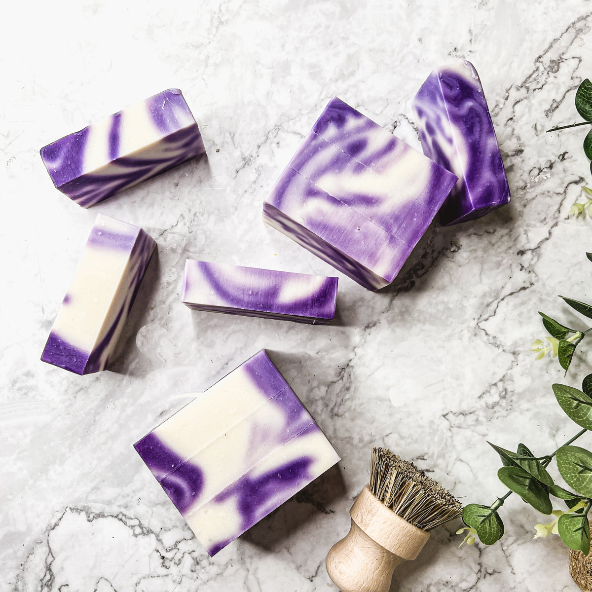 Lavender Swirl soap bar with a beautiful lavender color and unique handmade design, showcasing its organic ingredients and cold-pressed quality.