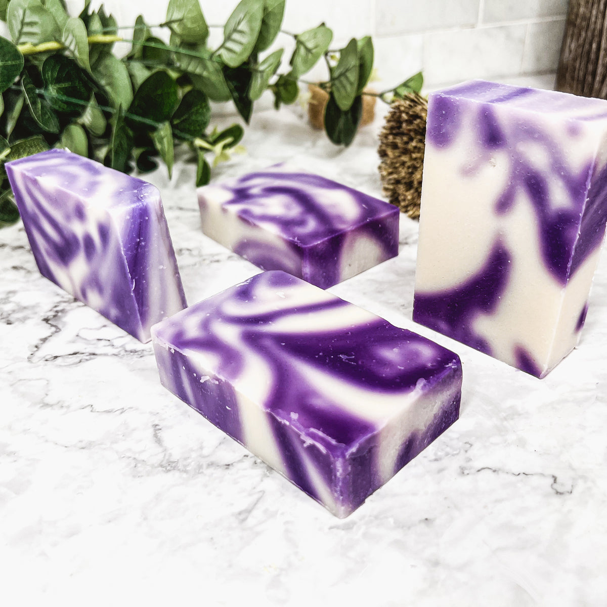 Lavender Swirl soap bar with a beautiful lavender color and unique handmade design, showcasing its organic ingredients and cold-pressed quality.