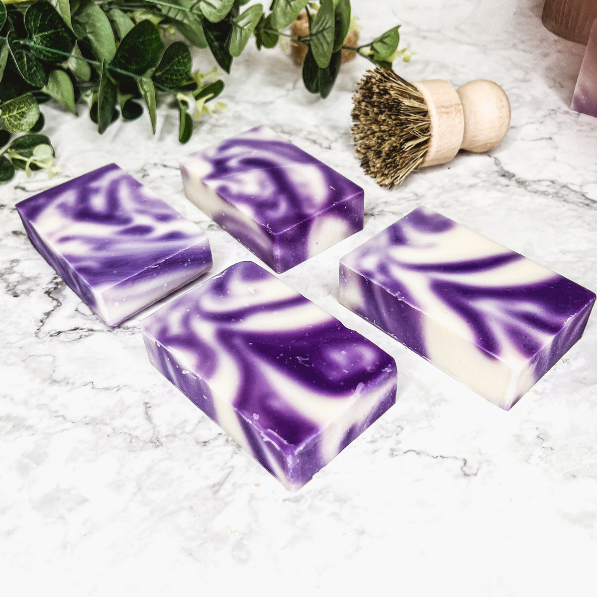 Lavender Swirl soap bar with a beautiful lavender color and unique handmade design, showcasing its organic ingredients and cold-pressed quality.