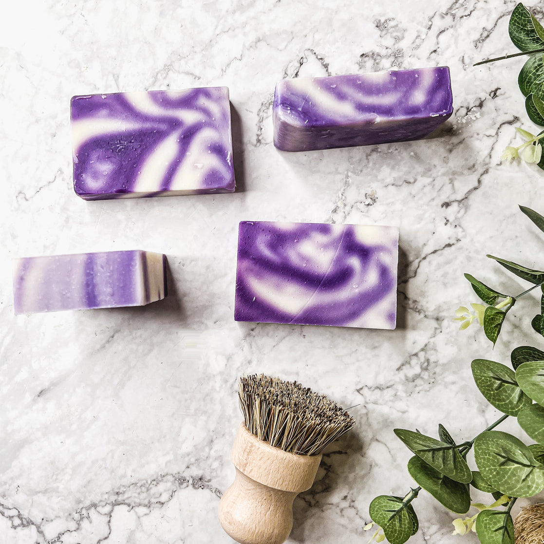 Lavender Swirl soap bar with a beautiful lavender color and unique handmade design, showcasing its organic ingredients and cold-pressed quality.