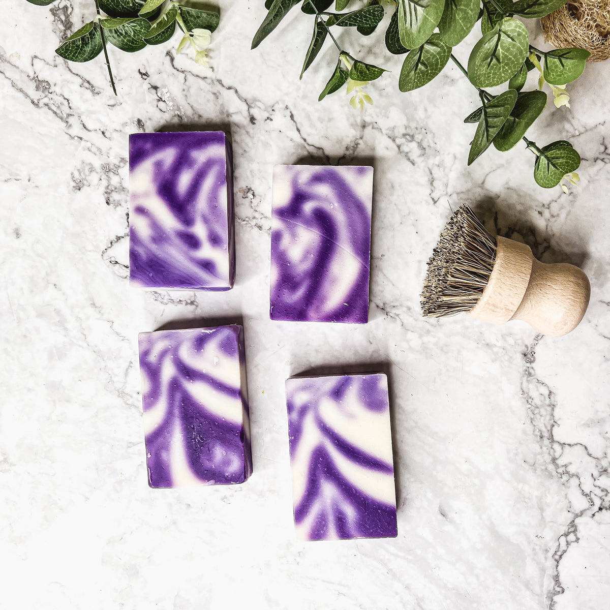 Lavender Swirl soap bar with a beautiful lavender color and unique handmade design, showcasing its organic ingredients and cold-pressed quality.