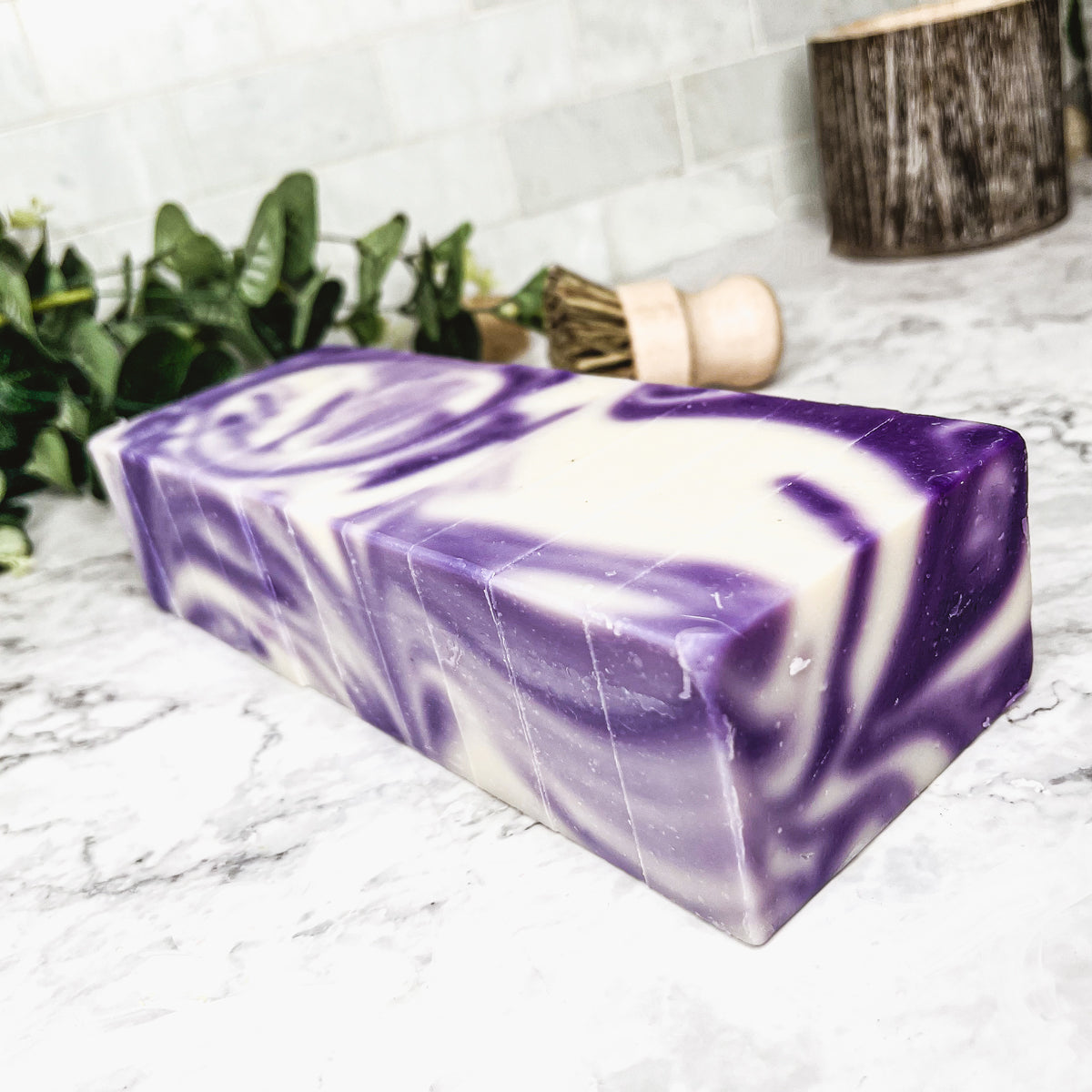 Lavender Swirl soap bar with a beautiful lavender color and unique handmade design, showcasing its organic ingredients and cold-pressed quality.