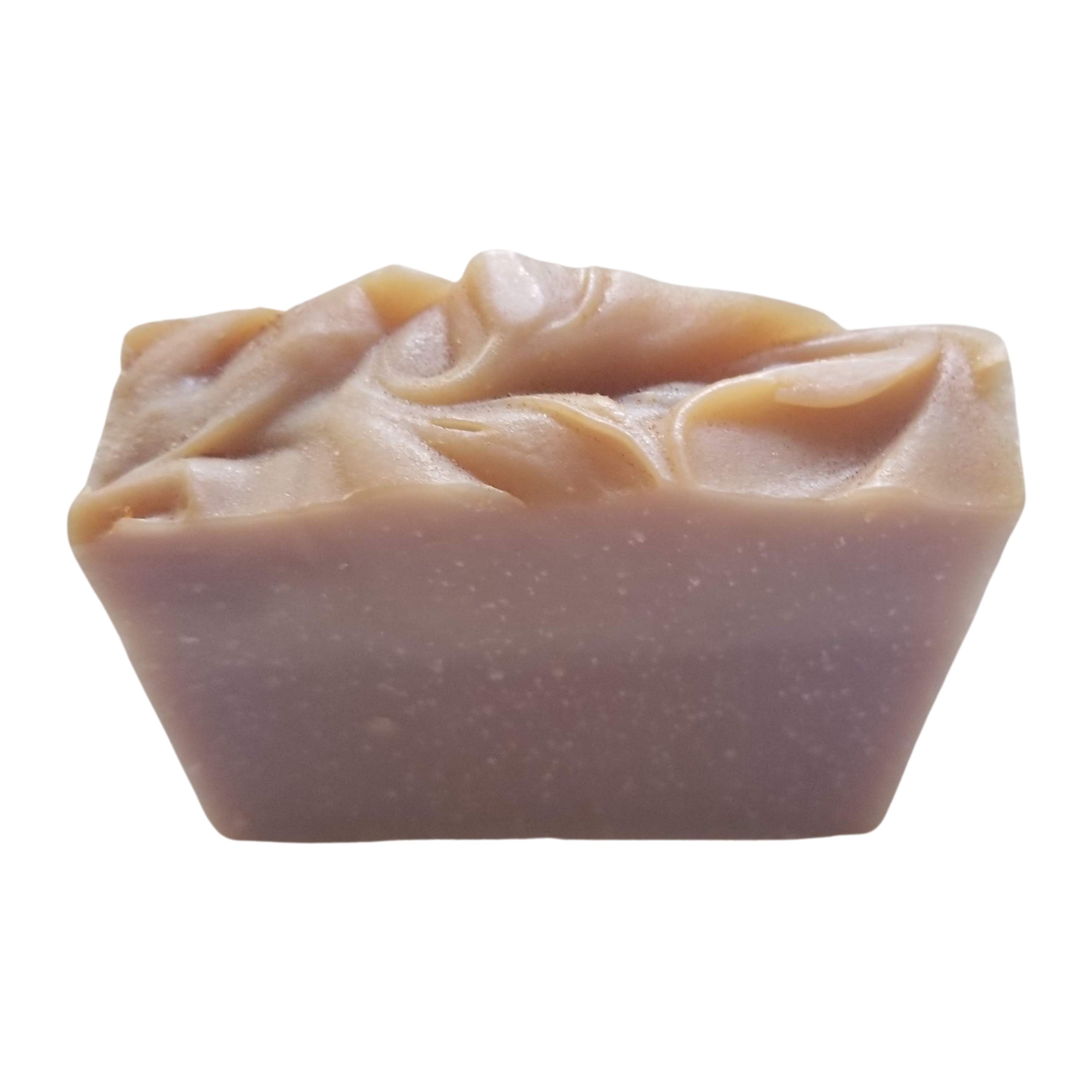 Lavender Vanilla Soap bar with rustic appearance and creamy texture, featuring lavender flowers and vanilla beans.