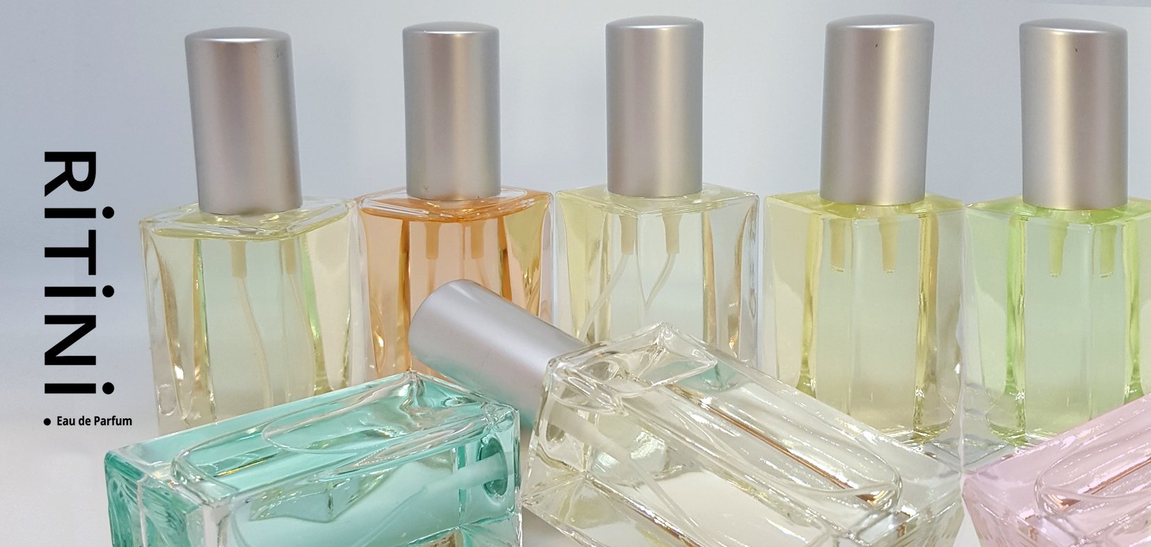 Set of three empty 50 ml perfume bottles with spray nozzles, ideal for DIY fragrances.