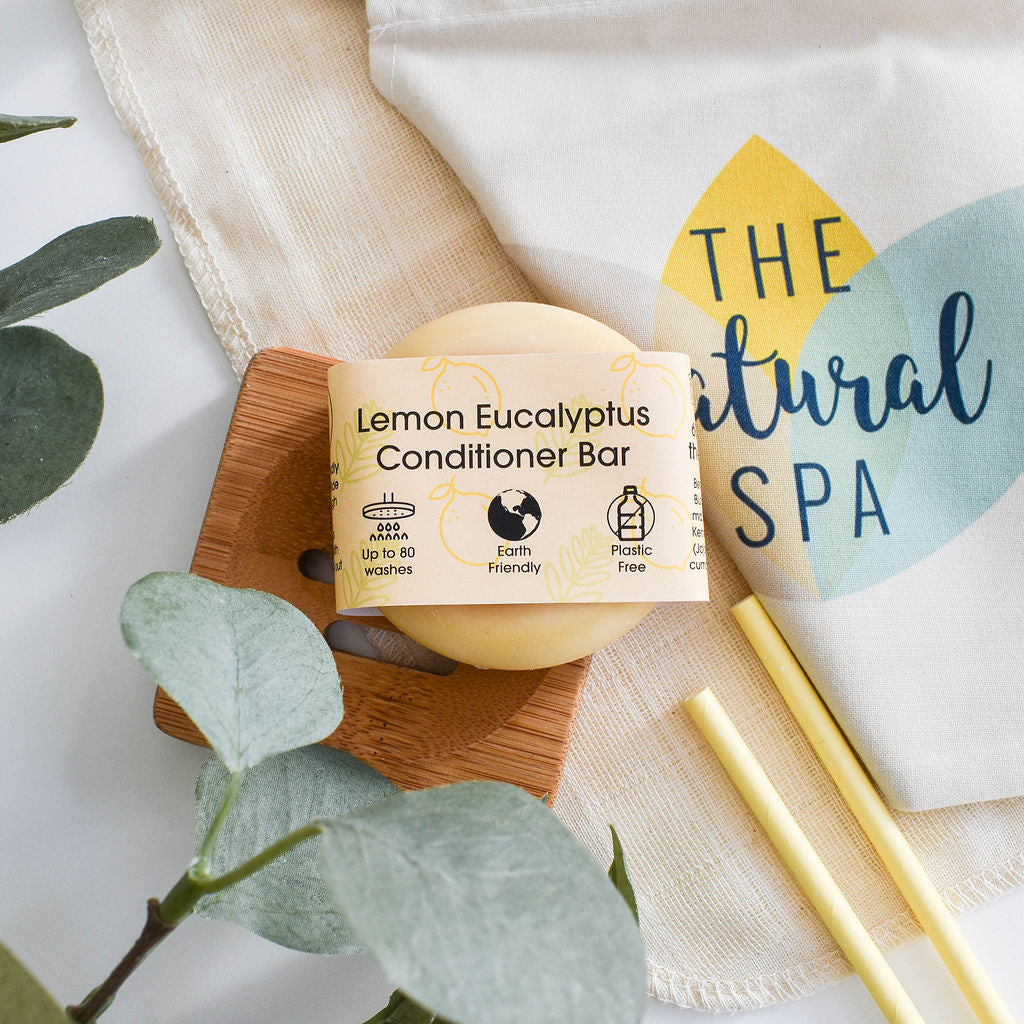 A vibrant solid conditioner bar infused with lemon and eucalyptus, showcasing its natural ingredients and eco-friendly packaging.