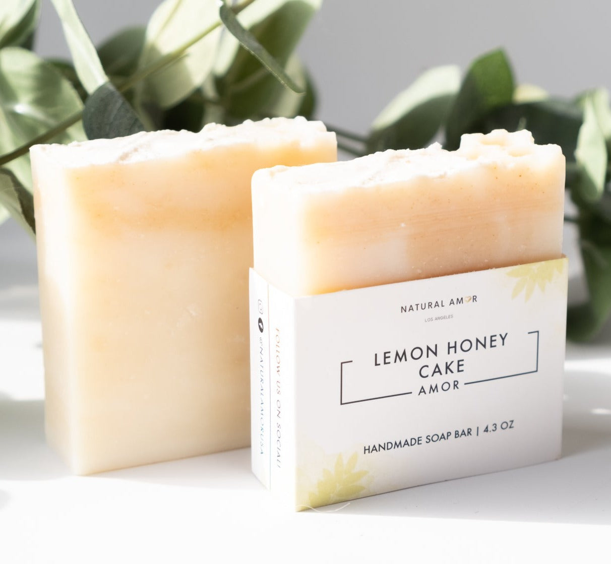 Lemon Honey Cake Soap Bar with a creamy texture and citrus scent, featuring natural ingredients like honey and turmeric.