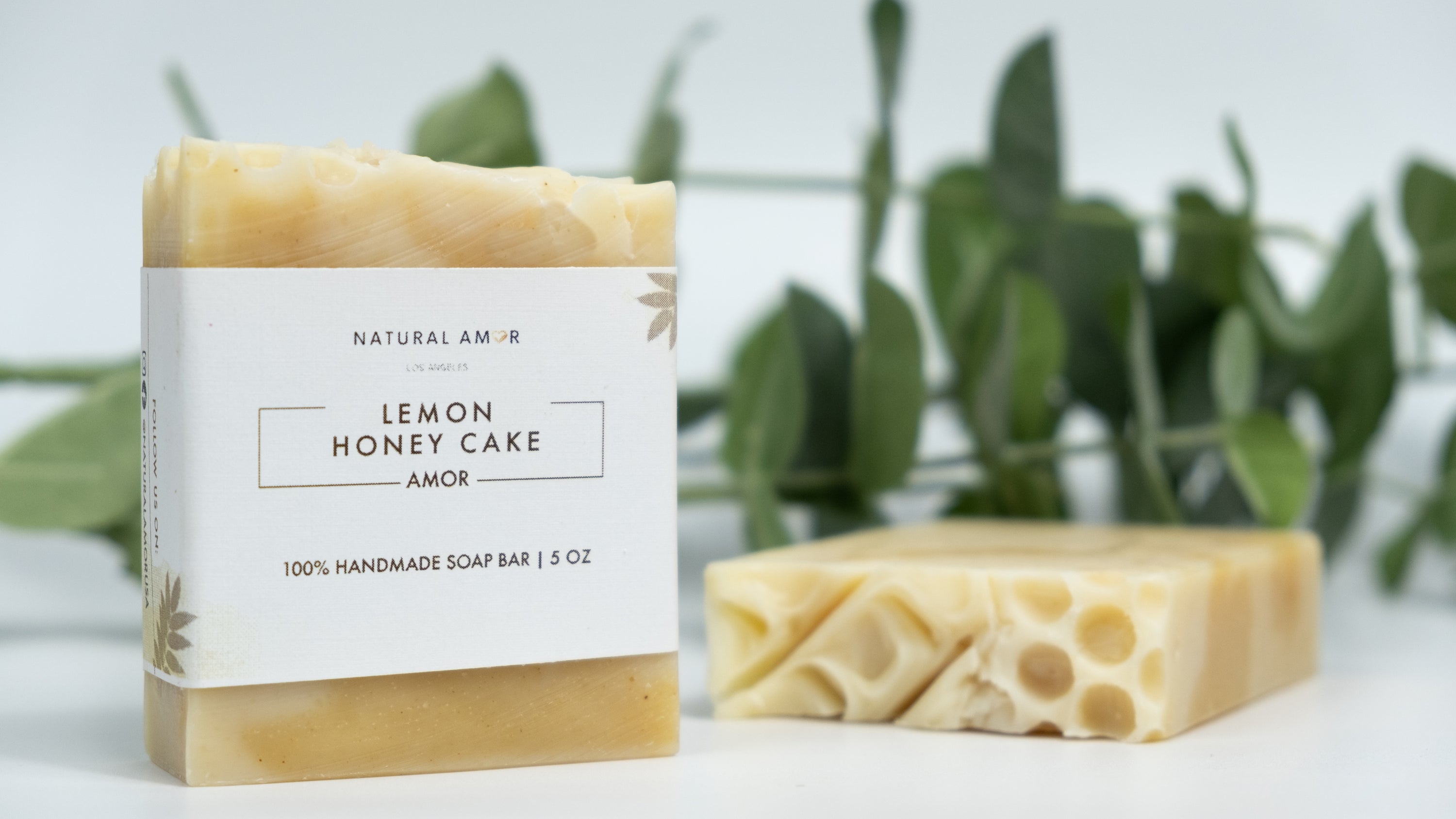 Lemon Honey Cake Soap Bar with a creamy texture and citrus scent, featuring natural ingredients like honey and turmeric.