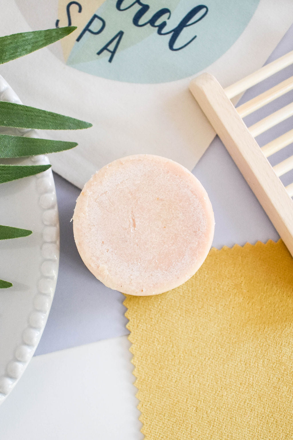 Lemon Shampoo Bar with vibrant yellow color, showcasing its unique handmade design and natural ingredients.