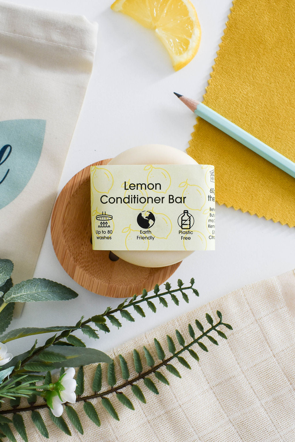 Lemon Solid Conditioner bar with a vibrant yellow color, showcasing its natural ingredients and eco-friendly packaging.