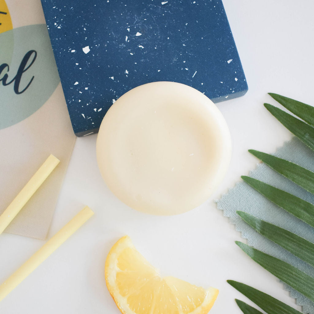 Lemon Solid Conditioner bar with a vibrant yellow color, showcasing its natural ingredients and eco-friendly packaging.