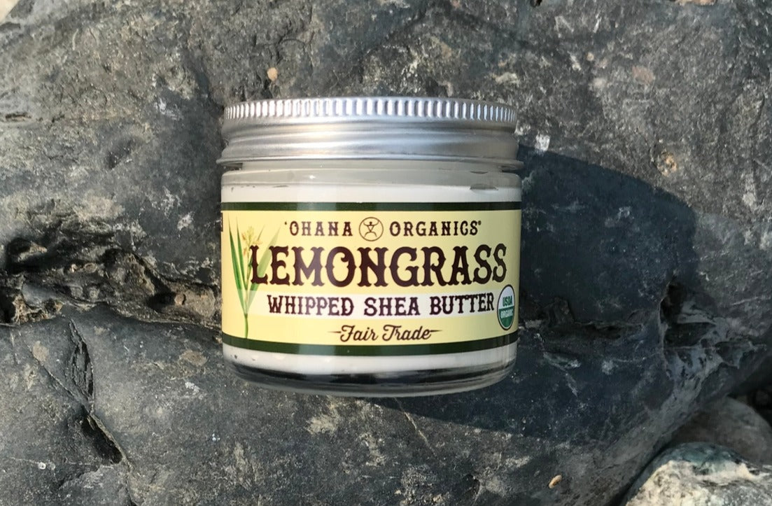 A 2oz jar of Lemongrass Whipped Shea Butter with a creamy texture, showcasing its organic ingredients and eco-friendly packaging.