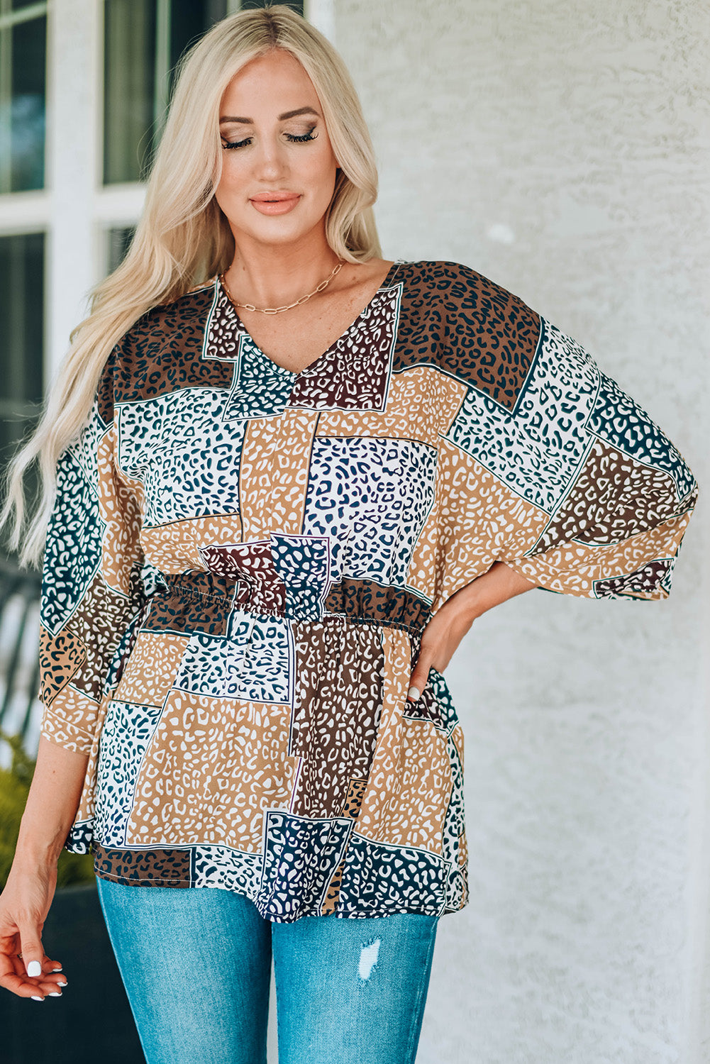 Leopard Colorblock V Neck Blouse with 3/4 sleeves, showcasing a stylish design perfect for summer wear.