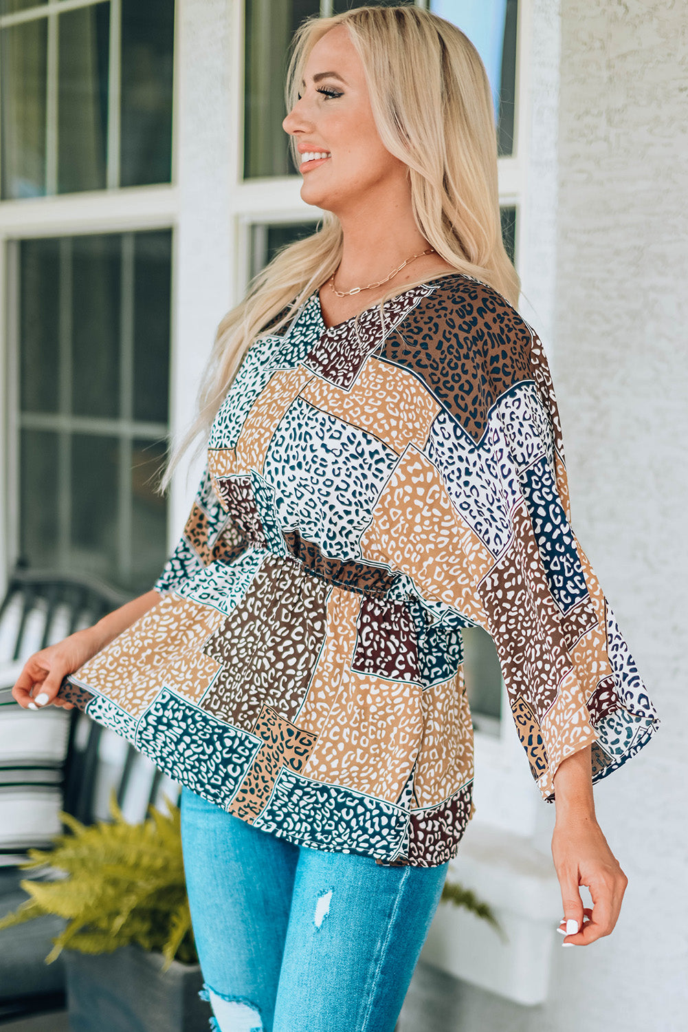 Leopard Colorblock V Neck Blouse with 3/4 sleeves, showcasing a stylish design perfect for summer wear.