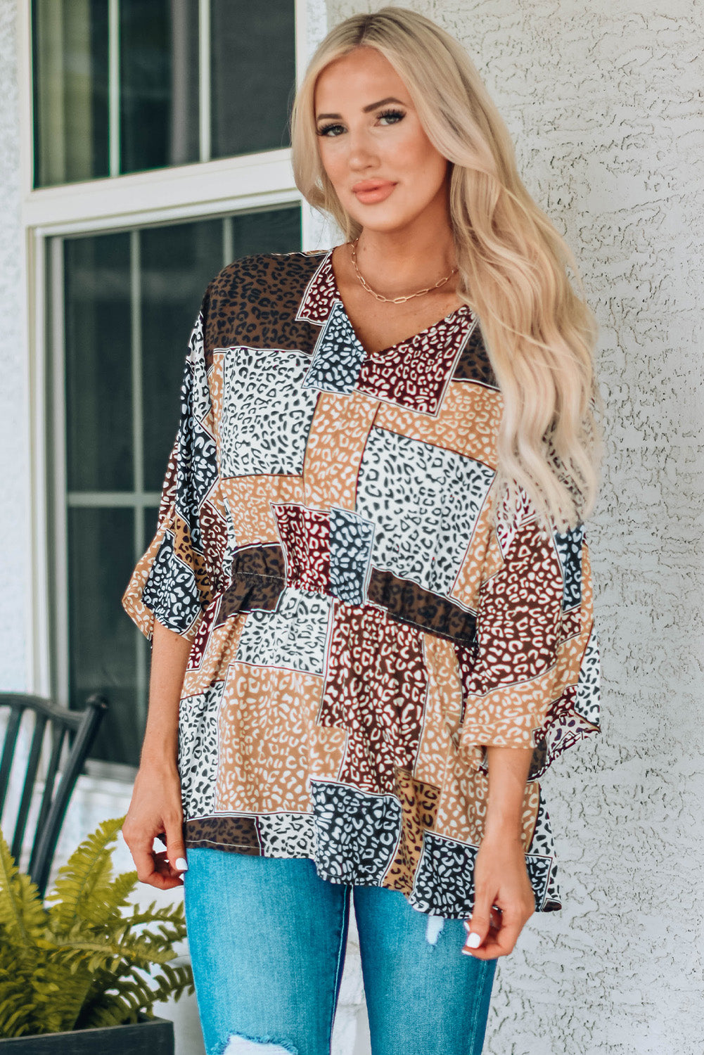 Leopard Colorblock V Neck Blouse with 3/4 sleeves, showcasing a stylish design perfect for summer wear.