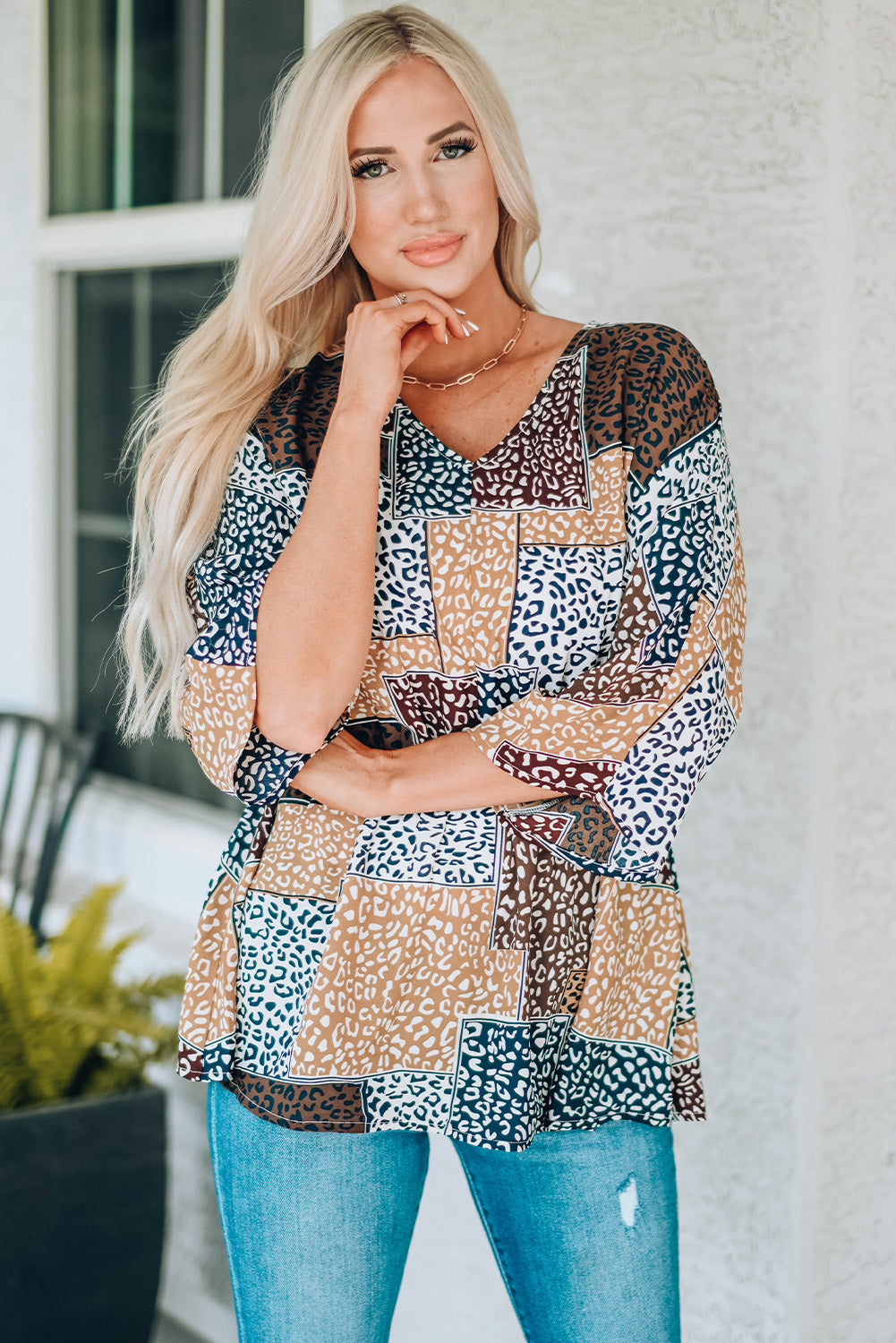 Leopard Colorblock V Neck Blouse with 3/4 sleeves, showcasing a stylish design perfect for summer wear.