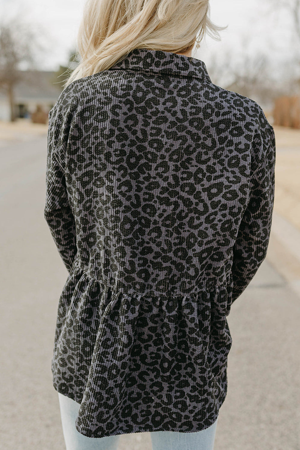 Leopard Corduroy Ruffled Shacket featuring a stylish leopard print, ruffled details, and flap pockets, perfect for modern women's fashion.