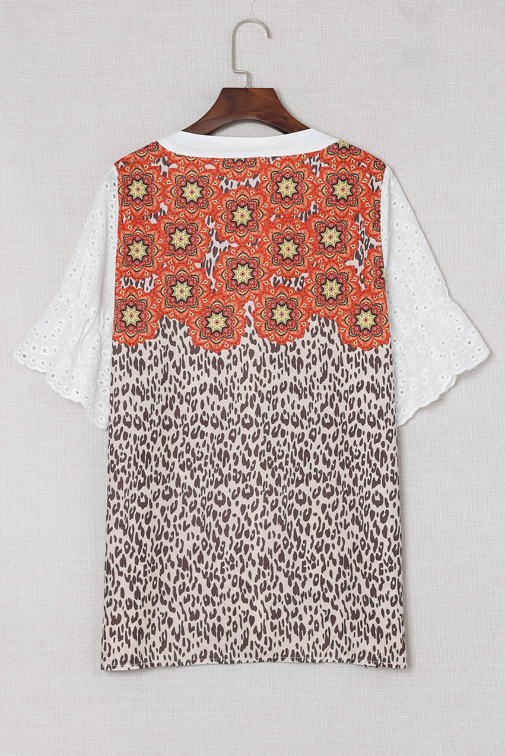 Leopard Mandala Hollow-out Sleeves T-shirt featuring floral pattern sleeves and a relaxed fit, perfect for bohemian style lovers.