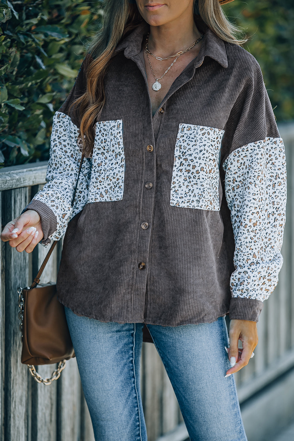 Leopard Patchwork Corduroy Buttoned Shirt Jacket featuring a stylish design with a turn-down collar and high-low hemline.