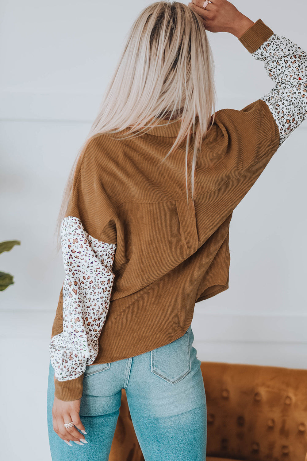 Leopard Patchwork Corduroy Buttoned Shirt Jacket featuring a stylish design with a turn-down collar and high-low hemline.