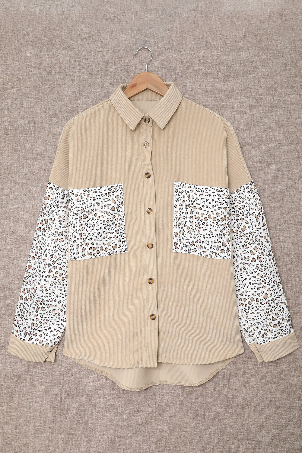 Leopard Patchwork Corduroy Buttoned Shirt Jacket featuring a stylish design with a turn-down collar and high-low hemline.