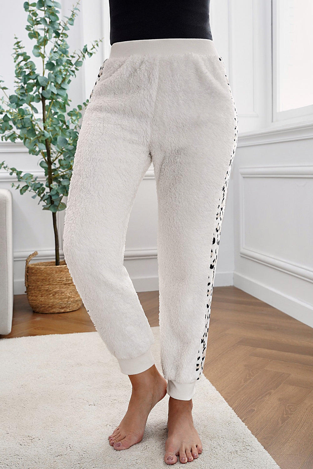 Leopard Patchwork Plush Jogger Pants showcasing stylish design and plush fabric, perfect for cold weather.