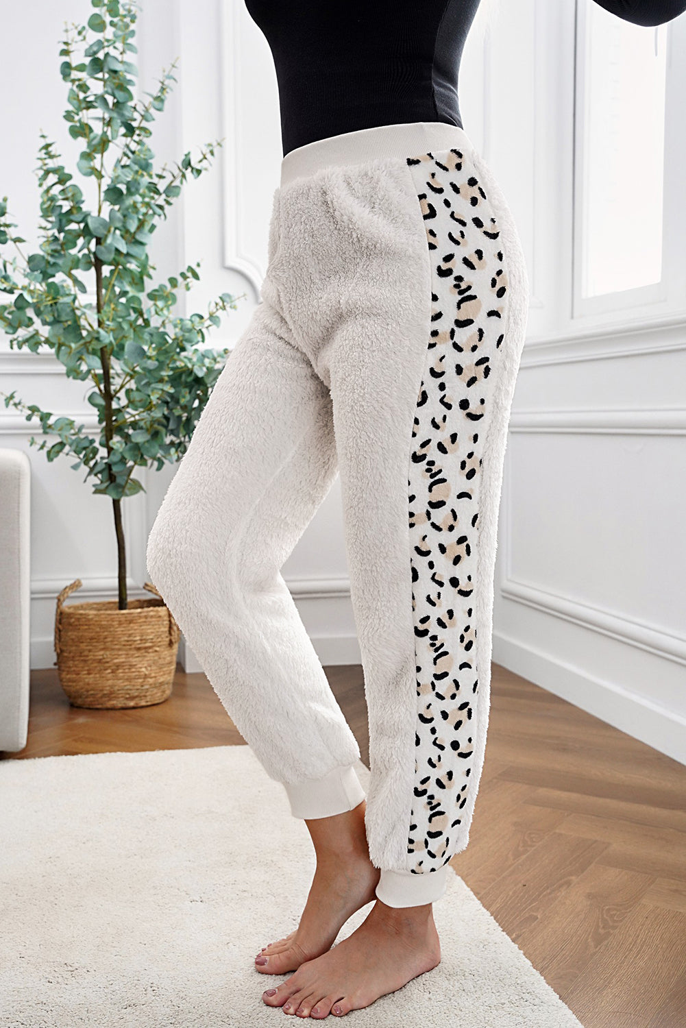 Leopard Patchwork Plush Jogger Pants showcasing stylish design and plush fabric, perfect for cold weather.