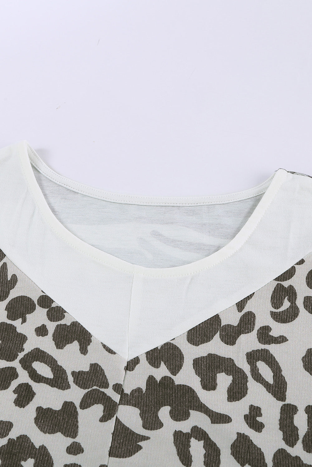 Leopard Plus Size T-Shirt featuring camo splicing and twist knot design, perfect for casual and trendy outfits.