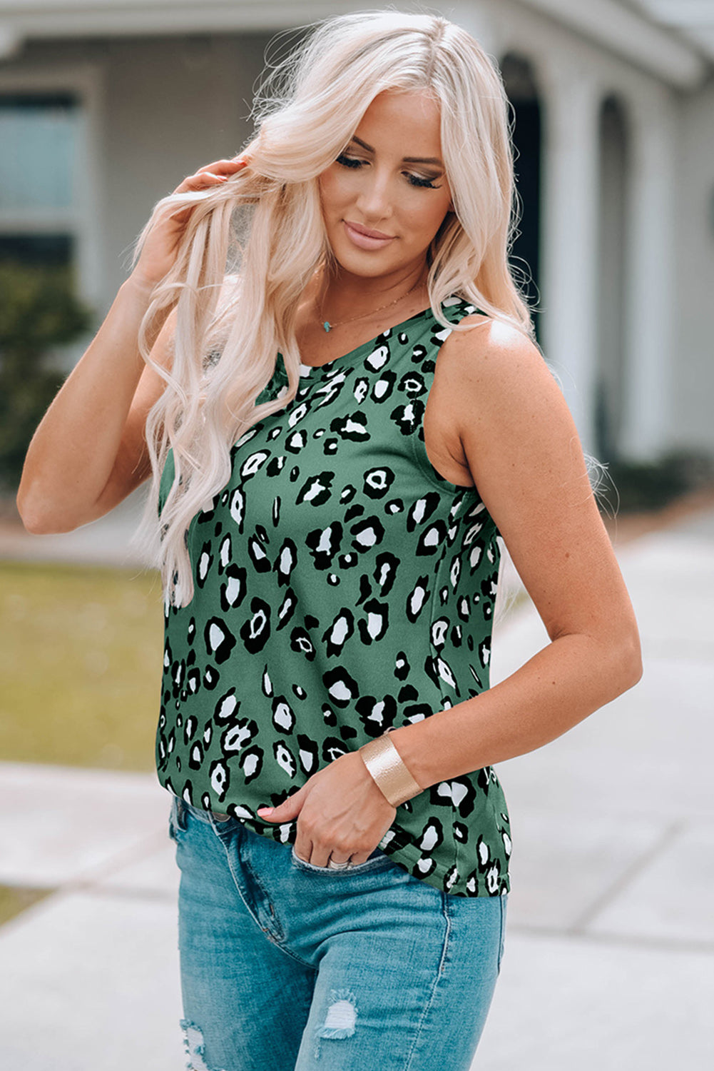 Leopard Print Crew Neck Tank Top displayed on a mannequin, showcasing its bold pattern and sleeveless design.