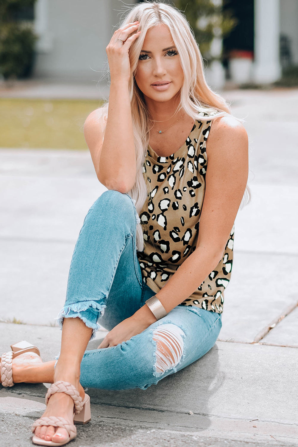 Leopard Print Crew Neck Tank Top displayed on a mannequin, showcasing its bold pattern and sleeveless design.