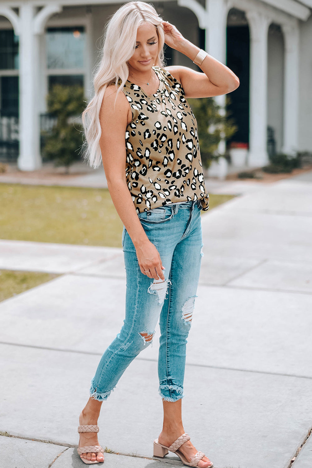 Leopard Print Crew Neck Tank Top displayed on a mannequin, showcasing its bold pattern and sleeveless design.