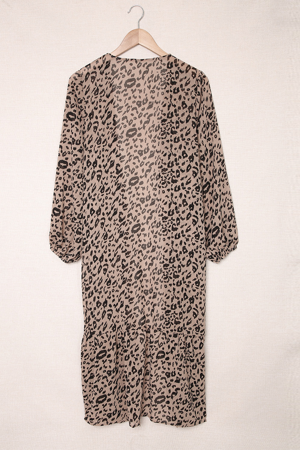 A stylish leopard print duster kimono with long sleeves and an open front, cascading to a mid-calf length, perfect for layering.