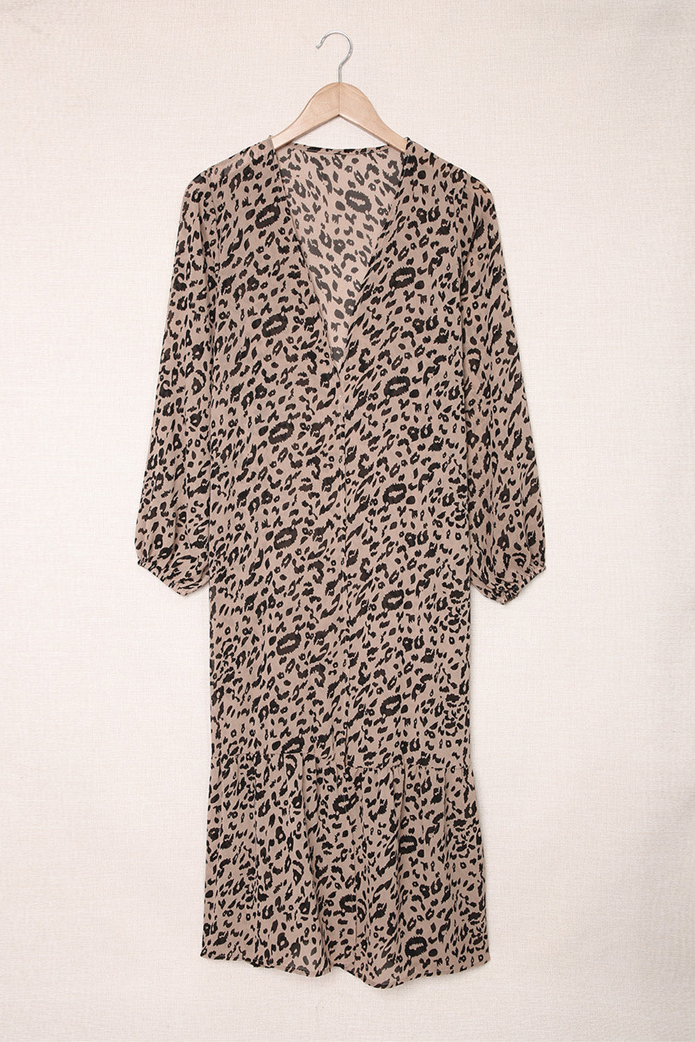 A stylish leopard print duster kimono with long sleeves and an open front, cascading to a mid-calf length, perfect for layering.