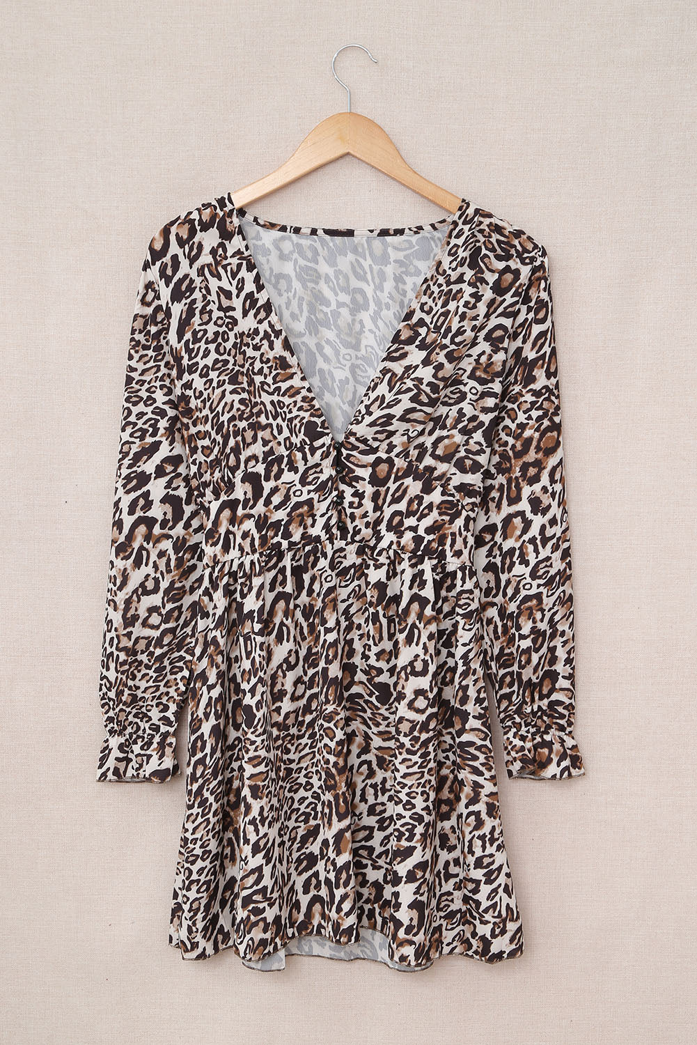 A stylish Leopard Ruffle V Neck Long Sleeve Tunic Mini Dress featuring a feminine ruffle design and a flattering V-neckline, perfect for casual outings.