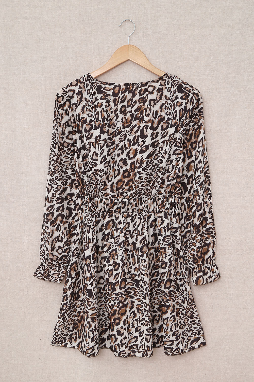 A stylish Leopard Ruffle V Neck Long Sleeve Tunic Mini Dress featuring a feminine ruffle design and a flattering V-neckline, perfect for casual outings.