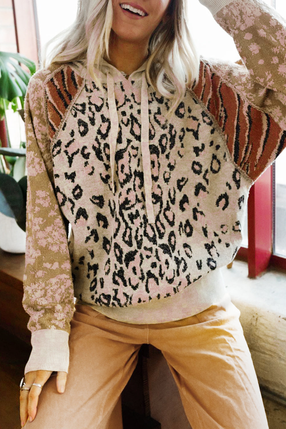 Leopard Wild Animal Patchwork Drawstring Hooded Sweater featuring a stylish pullover design with unique animal prints and comfortable raglan sleeves.