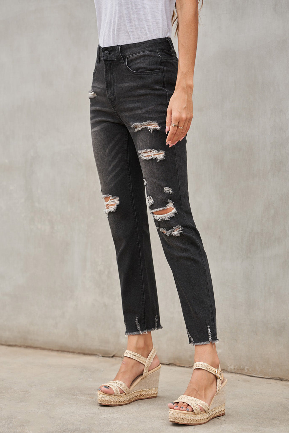 Light blue distressed boyfriend denim pants with a medium rise fit and straight leg silhouette, featuring classic five-pocket styling.