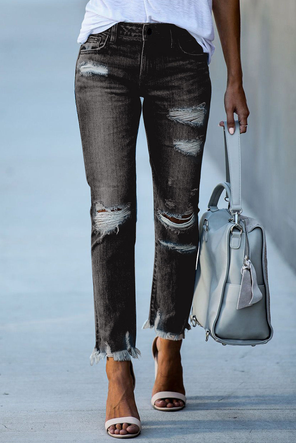 Light blue distressed boyfriend denim pants with a medium rise fit and straight leg silhouette, featuring classic five-pocket styling.