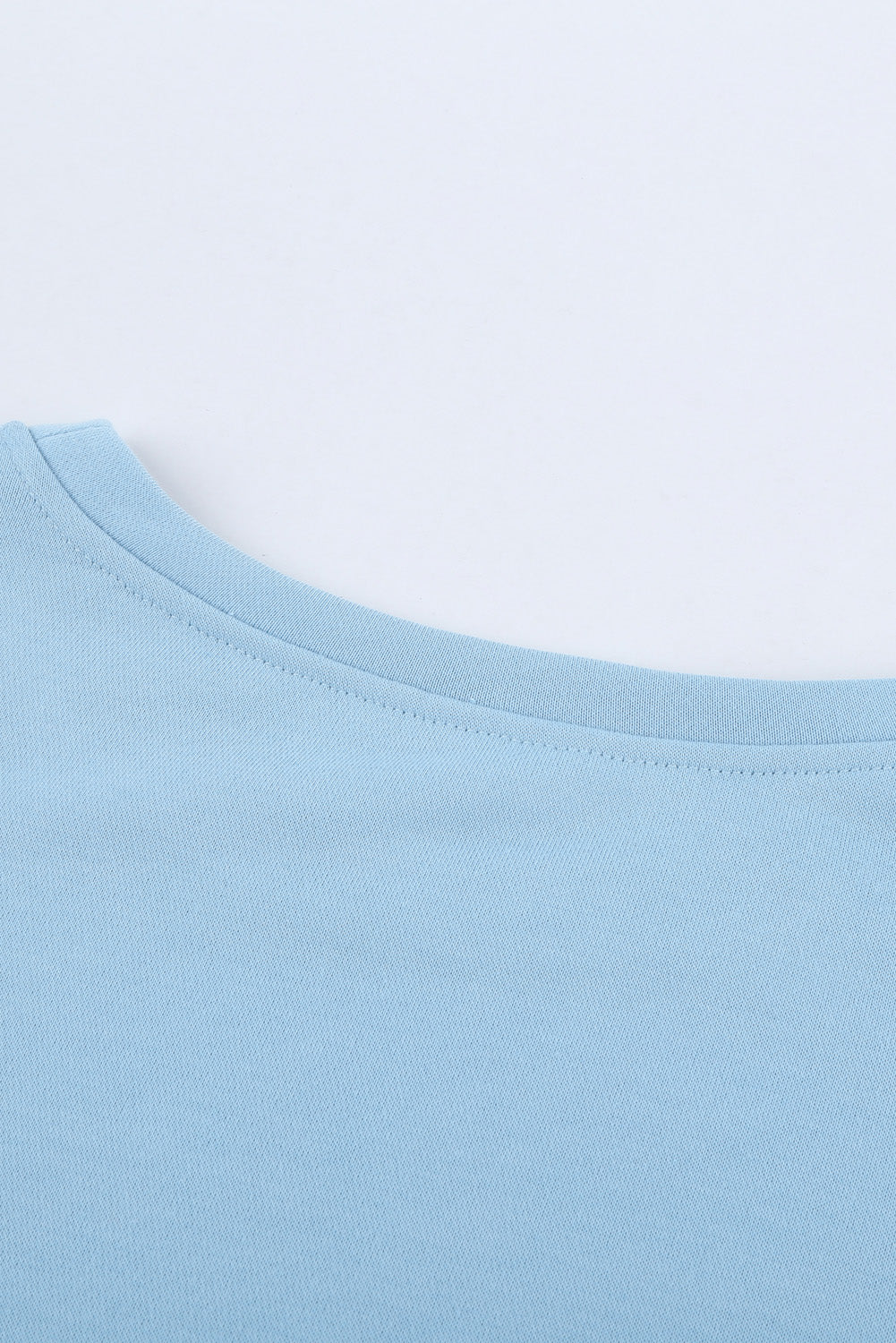 Light Blue Patchwork Dropped Shoulder Sweatshirt with color block design, showcasing a relaxed fit and soft fabric texture.