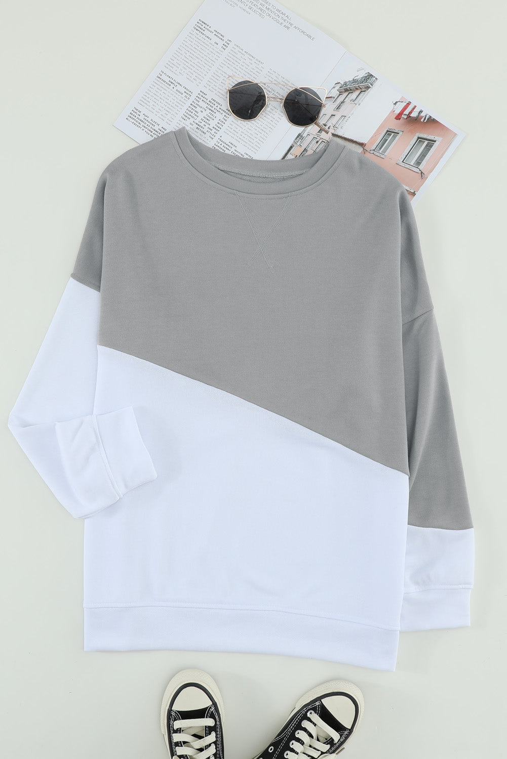 Light Blue Patchwork Dropped Shoulder Sweatshirt with color block design, showcasing a relaxed fit and soft fabric texture.