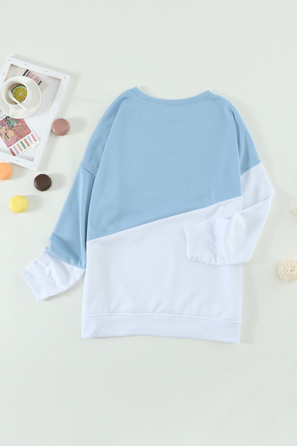 Light Blue Patchwork Dropped Shoulder Sweatshirt with color block design, showcasing a relaxed fit and soft fabric texture.