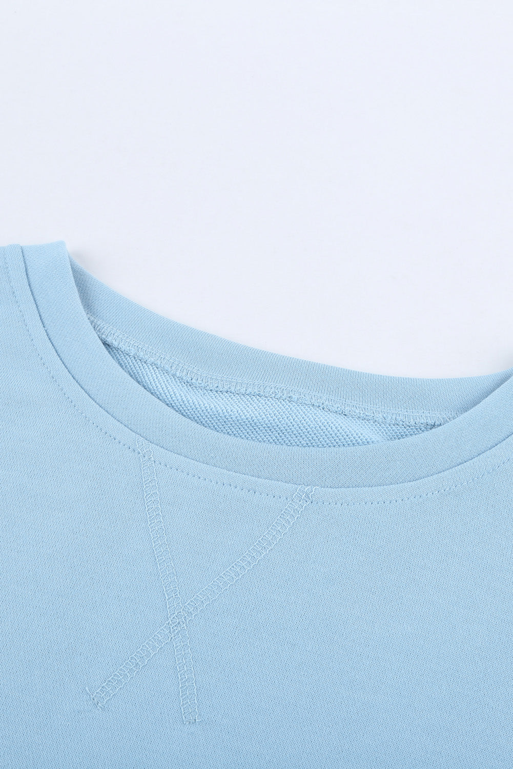 Light Blue Patchwork Dropped Shoulder Sweatshirt with color block design, showcasing a relaxed fit and soft fabric texture.