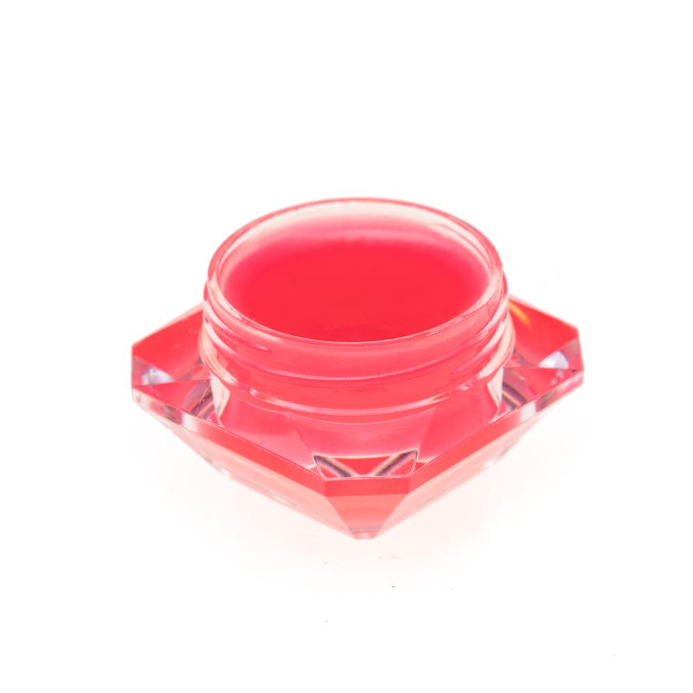 A creamy vegan lip butter in a small container, showcasing its smooth texture and natural ingredients.