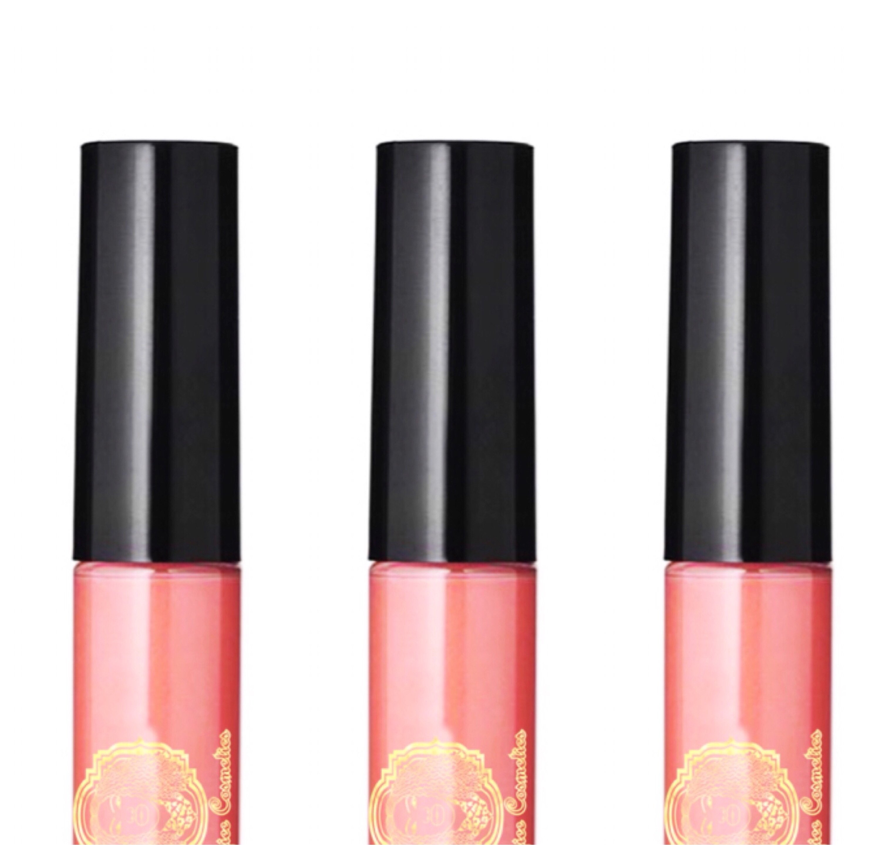 Lipgloss Disco in clear salmon melon shade with a creme texture, showcasing its glossy finish and stylish packaging.